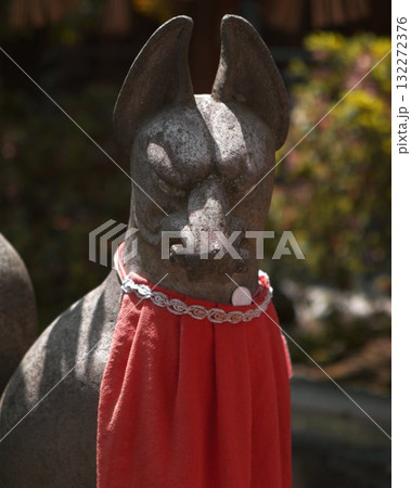 Japanese Stone fox statue with red collar 132272376