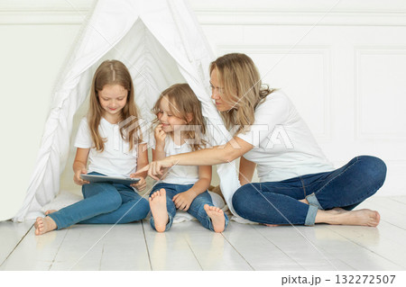 Female family using tablet gadget at home Female family using tablet gadget at home 132272507