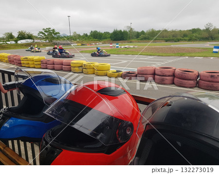 Go karting crash helmets in a row outdoors 132273019