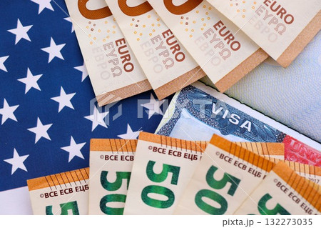 United States VISA in passport page with euro money bills on US flag close up. Entry tax to the US, visa fee tax, deposit euro upon entry to the USA 132273035