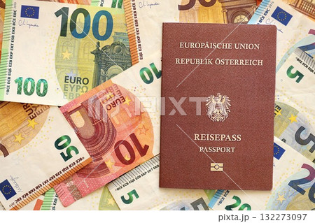Austria passport lies on big amount of euro money banknotes close up. Rich life and travel in Europe concept Austria passport lies on big amount of euro money banknotes close up. Rich life and travel in Europe concept 132273097