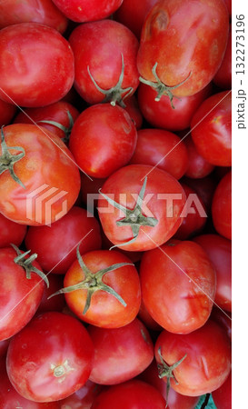 closeup top down view of a pile of ripe red tomatoes showcasing their vibrant color and fresh texture perfect for culinary use and healthy eating closeup top down view of a pile of ripe red tomatoes showcasing their vibrant color and fresh texture perfect for culinary use and healthy eating 132273196