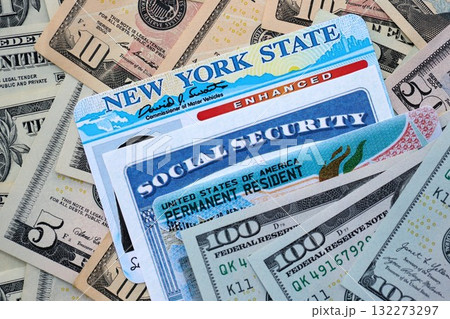 American US dollars money bills with permanent resident, social security ands driving license close up American US dollars money bills with permanent resident, social security ands driving license close up 132273297