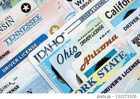 Big amount of driving licenses from various USA states. Stack of driving license specimen cards 132273320