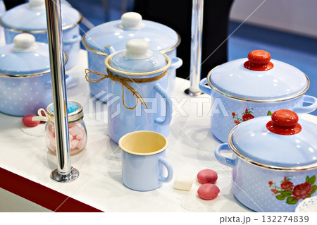 Enameled kitchen stock pots in store Enameled kitchen stock pots in store 132274839