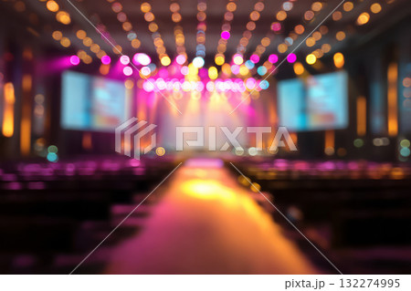 Defocused view of a conference hall, bright stage lighting Defocused view of a conference hall, bright stage lighting 132274995