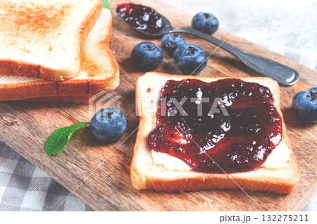 toast with blueberry jam, on a wooden chopping board, breakfast, homemade, no people, toast with blueberry jam, on a wooden chopping board, breakfast, homemade, no people, 132275211