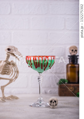 Halloween green zombie martini cocktail 132275302