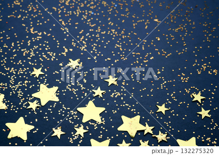 Abstract festive blue background with golden stars. Abstract festive blue background with golden stars. 132275320