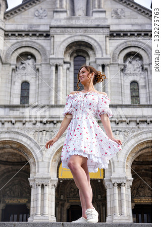Woman in floral dress walking near Sacre Coeur in Paris 132275763