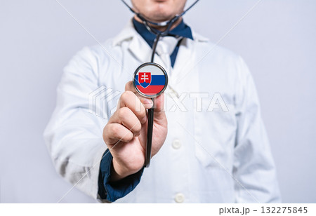 Doctor holding stethoscope with Slovak flag. Slovakia health and care concept 132275845