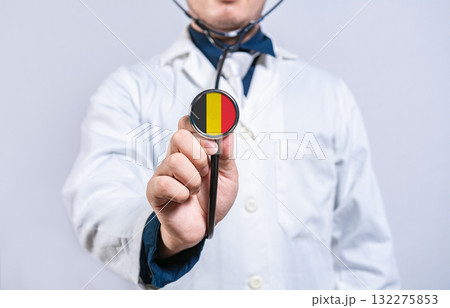 Doctor hands holding stethoscope with Belgium flag. Belgium health and care concept Doctor hands holding stethoscope with Belgium flag. Belgium health and care concept 132275853