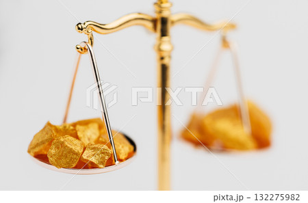 Beautiful Golden Balance Scales with little pieces of gold. Gold cost climbing up. Finance, gold theme Beautiful Golden Balance Scales with little pieces of gold. Gold cost climbing up. Finance, gold theme 132275982