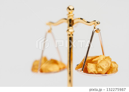 Beautiful Golden Balance Scales with little pieces of gold. Gold cost climbing up. Finance, gold theme Beautiful Golden Balance Scales with little pieces of gold. Gold cost climbing up. Finance, gold theme 132275987