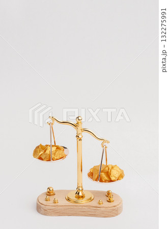 Beautiful Golden Balance Scales with little pieces of gold. Gold cost climbing up. Finance, gold theme 132275991