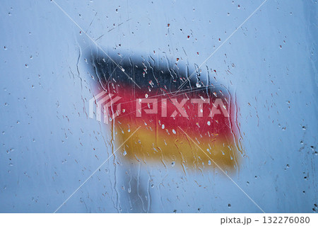 German Flag behind glass with raindrops 132276080