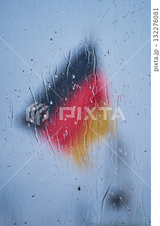 German Flag behind glass with raindrops 132276081