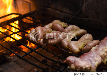 Cow bowels presented on a grill. Argentine Traditional cuisine. Cow bowels presented on a grill. Argentine Traditional cuisine. 132276742