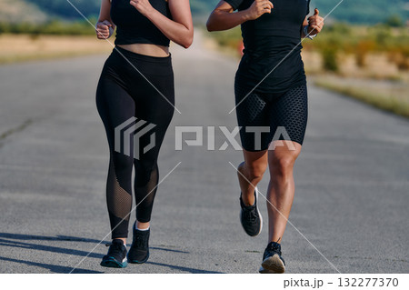 Two Friends Running Together on a Sunny Day, Preparing for Life's Extreme Challenges 132277370
