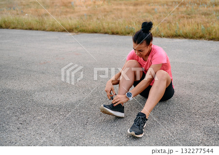 Athletic Woman Preparing for Morning Run Athletic Woman Preparing for Morning Run 132277544