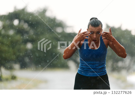 Unstoppable: A Determined Athlete Trains Through the Rain in Pursuit of Marathon Glory Unstoppable: A Determined Athlete Trains Through the Rain in Pursuit of Marathon Glory 132277626