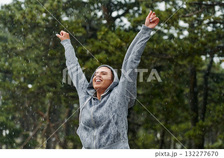 Beautiful Woman Enjoying Rainy Day After Intense Run 132277670