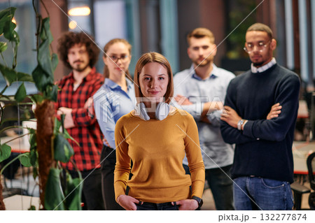 Portrait of successful creative business team looking at camera and smiling. Diverse business people standing together at startup. Selective focus Portrait of successful creative business team looking at camera and smiling. Diverse business people standing together at startup. Selective focus 132277874