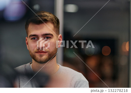 Close-up European Businessman Engaging with Colleagues in Office Discussion Close-up European Businessman Engaging with Colleagues in Office Discussion 132278218