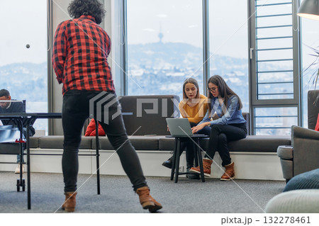 Business colleagues take a break from work to enjoy a game of table tennis, fostering teamwork and camaraderie in the workplace Business colleagues take a break from work to enjoy a game of table tennis, fostering teamwork and camaraderie in the workplace 132278461