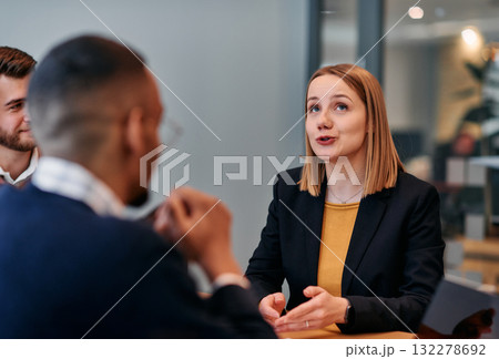 Businesswoman Leading Discussion in Modern Office Setting Businesswoman Leading Discussion in Modern Office Setting 132278692