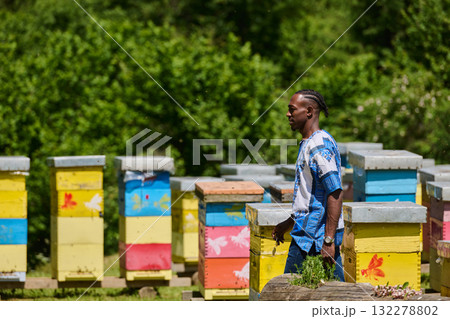 African American Teenager Exploring Small Beekeeping Businesses in Traditional Sudanese Attire amidst Nature African American Teenager Exploring Small Beekeeping Businesses in Traditional Sudanese Attire amidst Nature 132278802