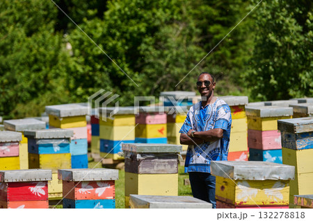 African American Teenager Exploring Small Beekeeping Businesses in Traditional Sudanese Attire amidst Nature 132278818