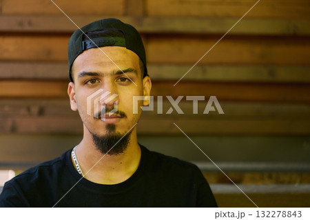 Close Up Portrait of Smiling Sudanese Teenager with Broad Smile, Chin, and Cap 132278843