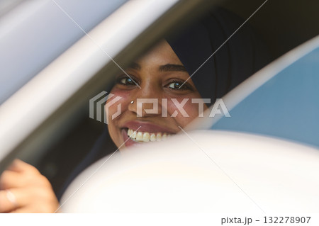 Middle Eastern Teenage Girl Driving Through Scenic Nature 132278907