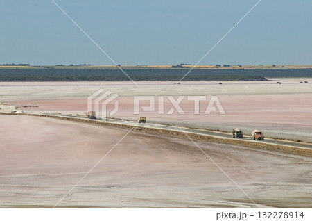 Trucks unloading raw salt bulk, Salinas Grandes de Hidalgo, La Pampa, Argentina. Trucks unloading raw salt bulk, Salinas Grandes de Hidalgo, La Pampa, Argentina. 132278914