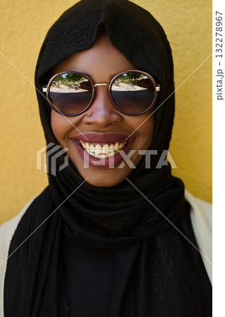 Close Up Portrait of Middle Eastern Muslim Woman Against Yellow Background Close Up Portrait of Middle Eastern Muslim Woman Against Yellow Background 132278967