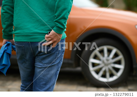 Close Up of a Man Retrieving His Phone from His Jeans Pocket. 132279011