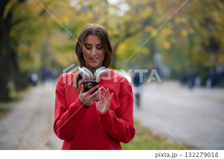 Athletic young woman taking a breath and relaxing after jogging and stretching. Woman Training and Workout Exercises On Street. 132279018