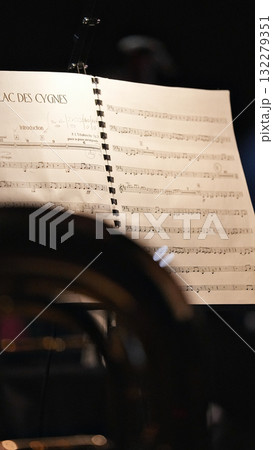 Classical music sheet on stand with dark atmospheric background Classical music sheet on stand with dark atmospheric background 132279351