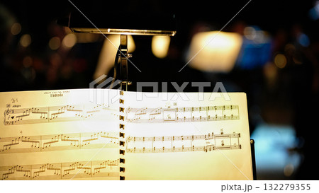 Musical score with clip light and bokeh background at orchestra rehearsal 132279355