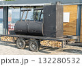 Large Black Barbecue Smoker Trailer Parked Near the Waterfront 132280532