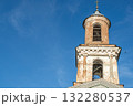Old Bell Tower Against Bright Blue Sky on a Clear Day in the Town 132280537