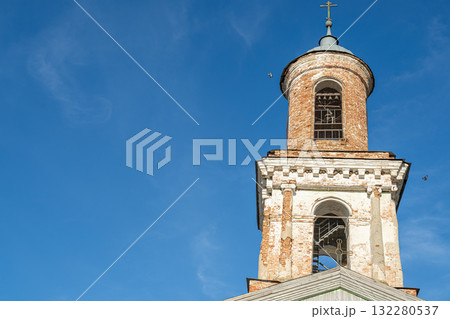 Old Bell Tower Against Bright Blue Sky on a Clear Day in the Town Old Bell Tower Against Bright Blue Sky on a Clear Day in the Town 132280537