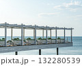 Relaxing Lounge Area on a Pier by the Ocean During a Sunny Day 132280539