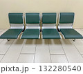 Empty Waiting Area With Green Chairs in a Quiet Airport Terminal 132280540