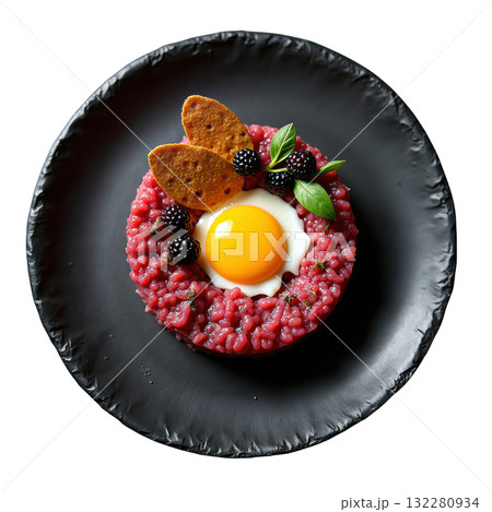 Delicious gourmet Elk Tartare appetizer with raw egg yolk and pumpernickel on dark plate, sophisticated dish Delicious gourmet Elk Tartare appetizer with raw egg yolk and pumpernickel on dark plate, sophisticated dish 132280934