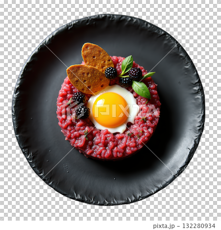 Delicious gourmet Elk Tartare appetizer with raw egg yolk and pumpernickel on dark plate, sophisticated dish 132280934