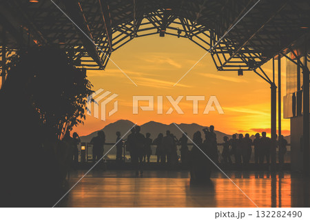 Oct 1 2025 Sunset Silhouettes On A Modern Rooftop Pier As People 132282490