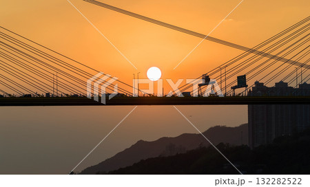 Oct 7 2025 Sunset Over Bridge With Silhouetted Bus, Cables, And Industrial Structures 132282522