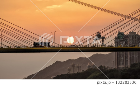Oct 7 2025 Sunset Over Bridge With Silhouetted Bus, Cables, And Industrial Structures 132282530